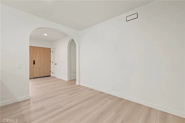 a bathroom with double vanity sinks and two mirrors