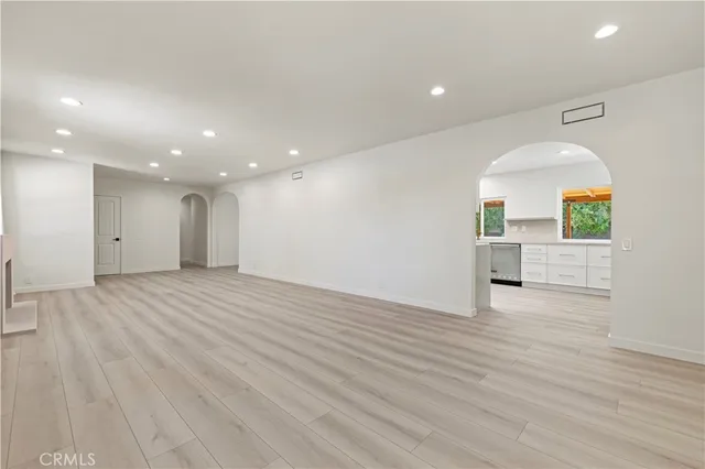 a stove top oven sitting inside of a kitchen