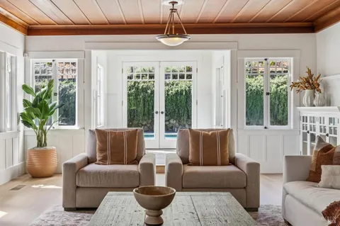 a view of balcony with wooden floor and fence