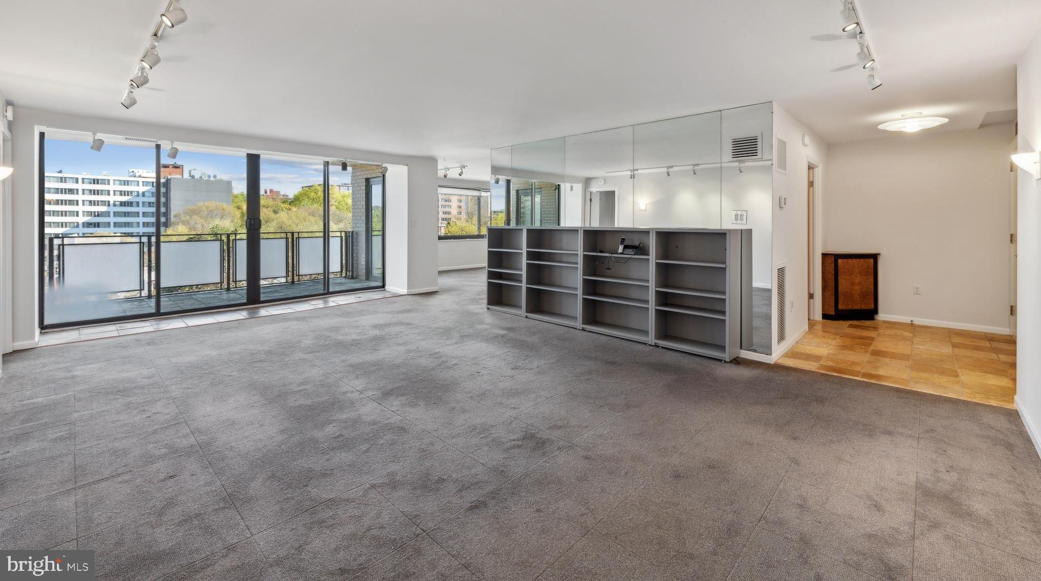 800 25th Street Northwest, Unit 605 Washington, DC 20037 - Photo 1 of 35 a view of an empty room with furniture and a window