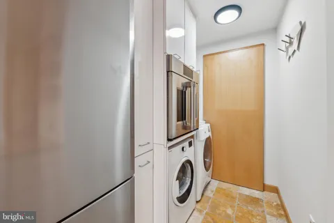 a kitchen with stainless steel appliances granite countertop a sink and a stove