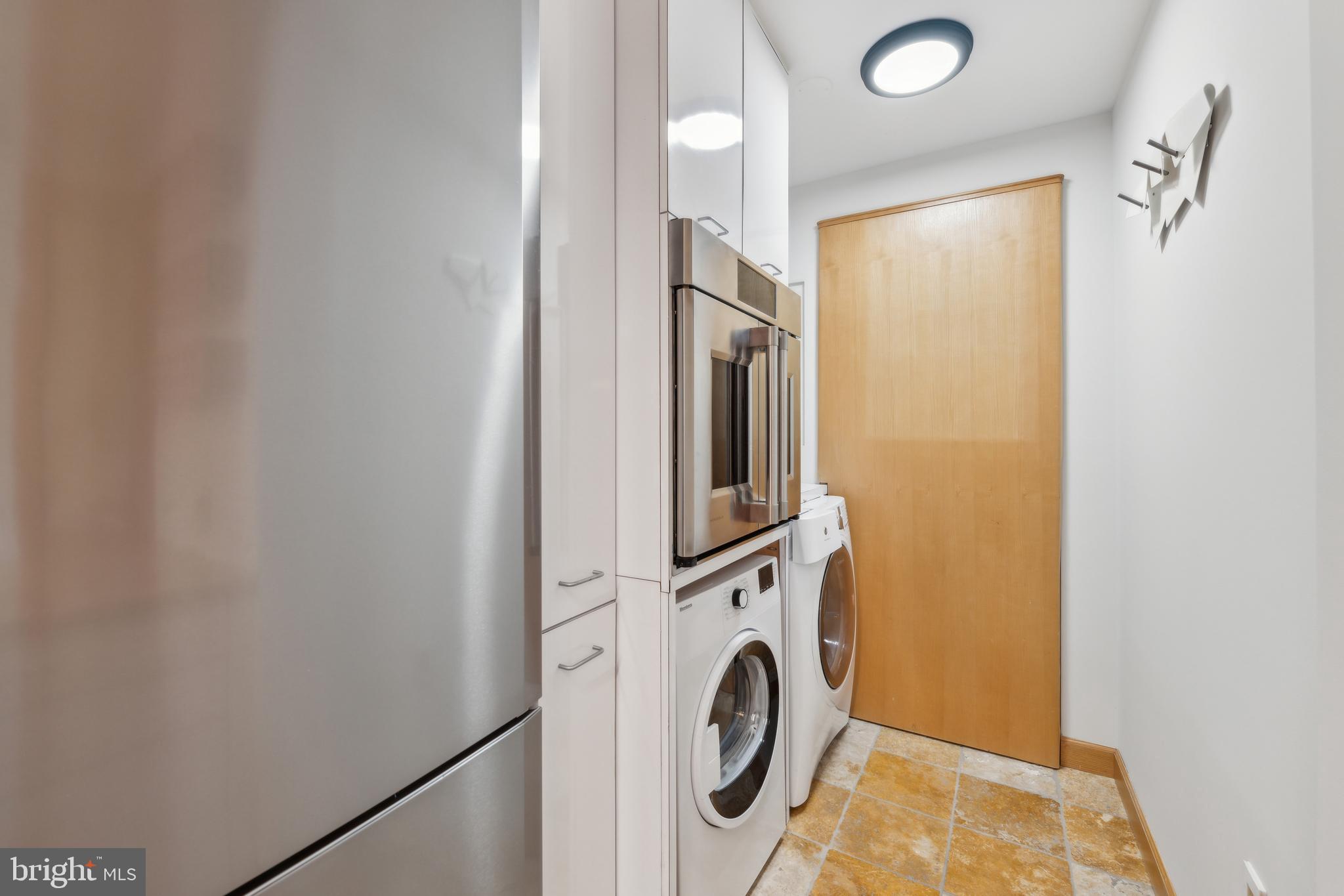 800 25th Street Northwest, Unit 605 Washington, DC 20037 - Photo 12 of 35 a view of a storage & utility room with washer and dryer