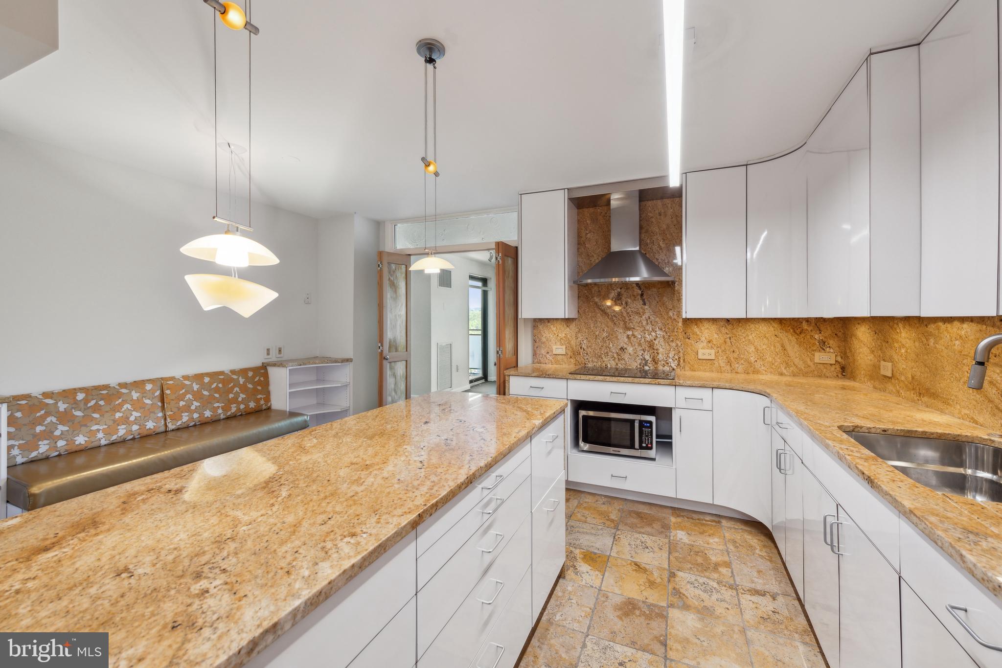 800 25th Street Northwest, Unit 605 Washington, DC 20037 - Photo 13 of 35 a kitchen with stainless steel appliances granite countertop a sink and a stove
