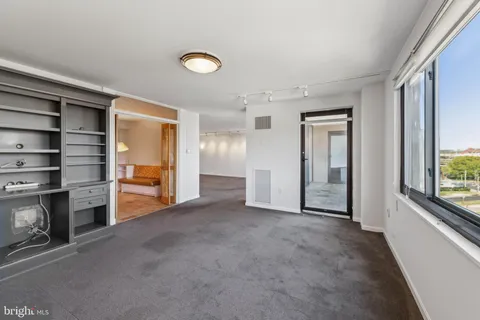 wooden view of an empty room with a window