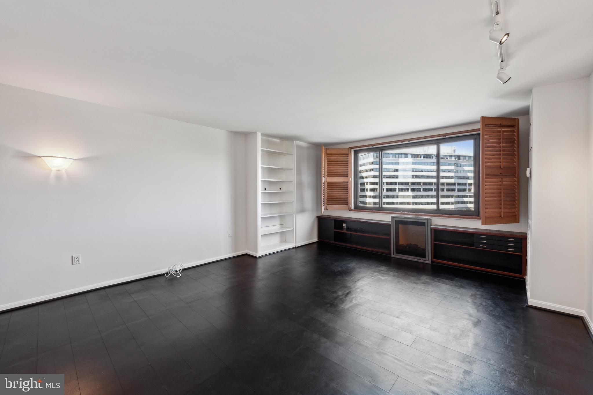 800 25th Street Northwest, Unit 605 Washington, DC 20037 - Photo 22 of 35 a view of a room with wooden floor and windows