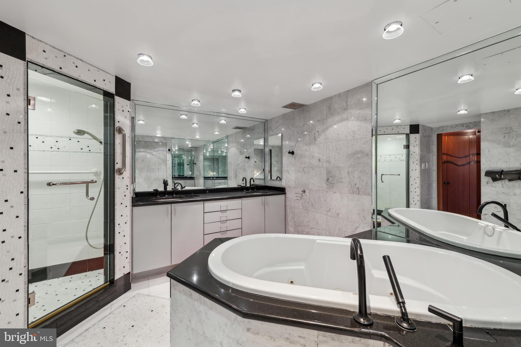 800 25th Street Northwest, Unit 605 Washington, DC 20037 - Photo 27 of 35 a bathroom with a bathtub and a shower