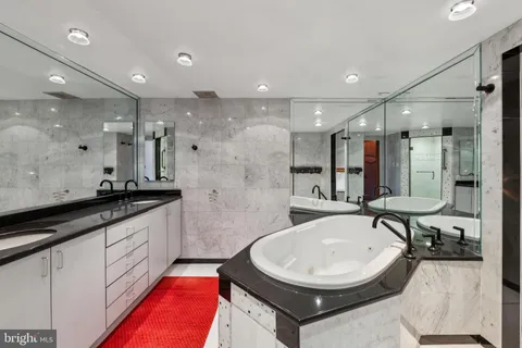 a bathroom with a bathtub and a sink