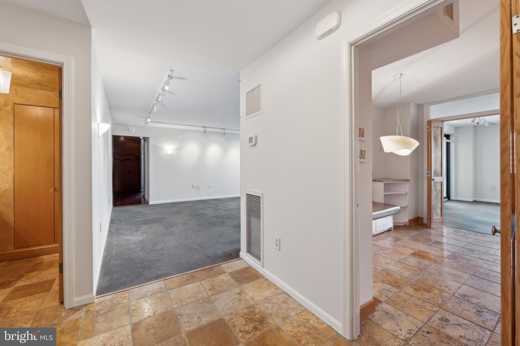 800 25th Street Northwest, Unit 605 Washington, DC 20037 - Photo 3 of 35 a view of a hallway with wooden shelves