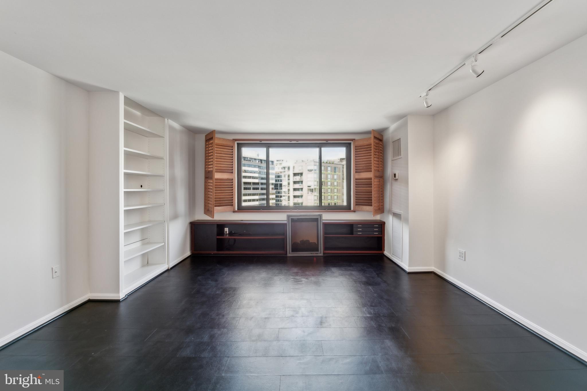 800 25th Street Northwest, Unit 605 Washington, DC 20037 - Photo 32 of 35 a view of room with window and wooden floor