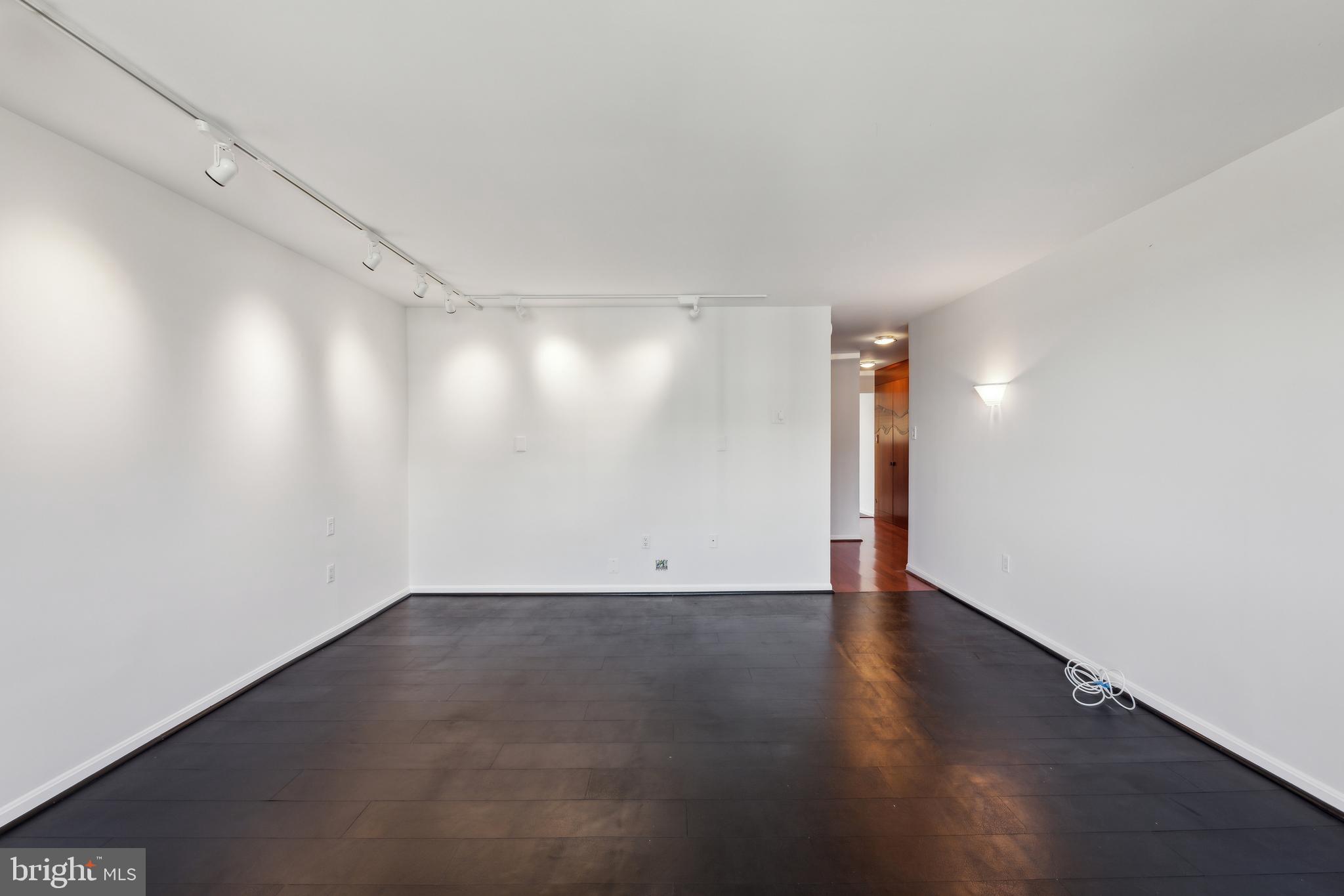 800 25th Street Northwest, Unit 605 Washington, DC 20037 - Photo 33 of 35 a view of an empty room with wooden floor