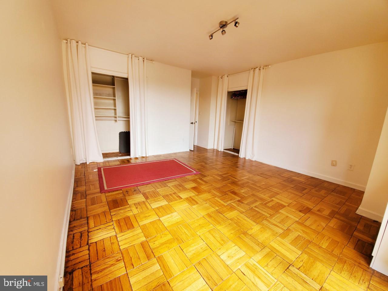 4301 Massachusetts Avenue Northwest, Unit 6007 Washington, DC 20016 - Photo 11 of 24 a large room with a bed