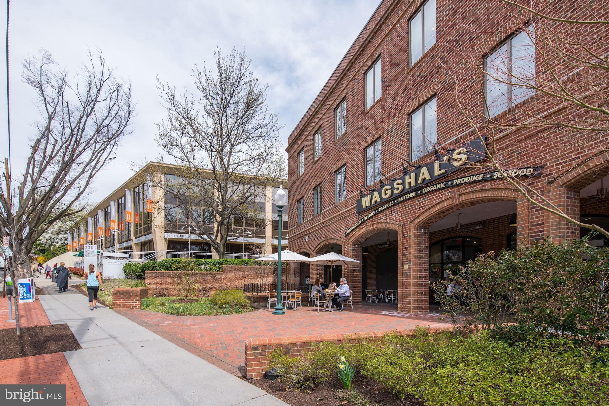 4301 Massachusetts Avenue Northwest, Unit 6007 Washington, DC 20016 - Photo 19 of 24 a view of a building with a yard