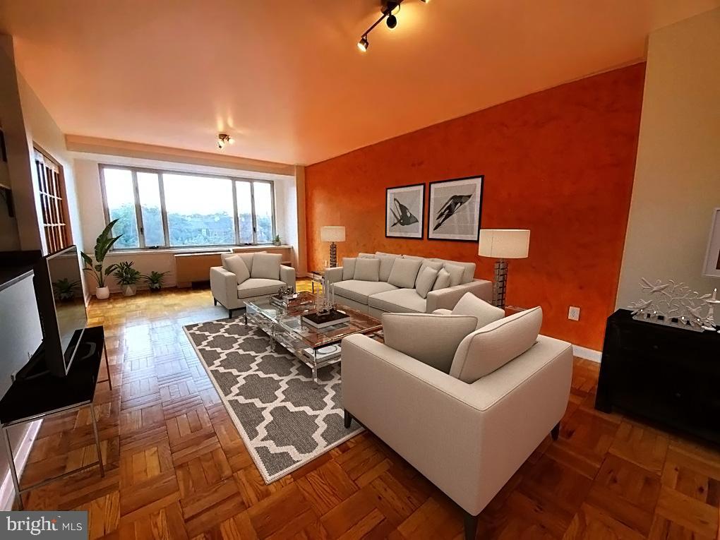 4301 Massachusetts Avenue Northwest, Unit 6007 Washington, DC 20016 - Photo 4 of 24 a living room with furniture rug and a large window