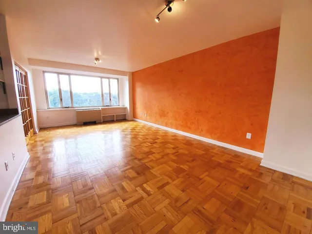 a view of an empty room with a window