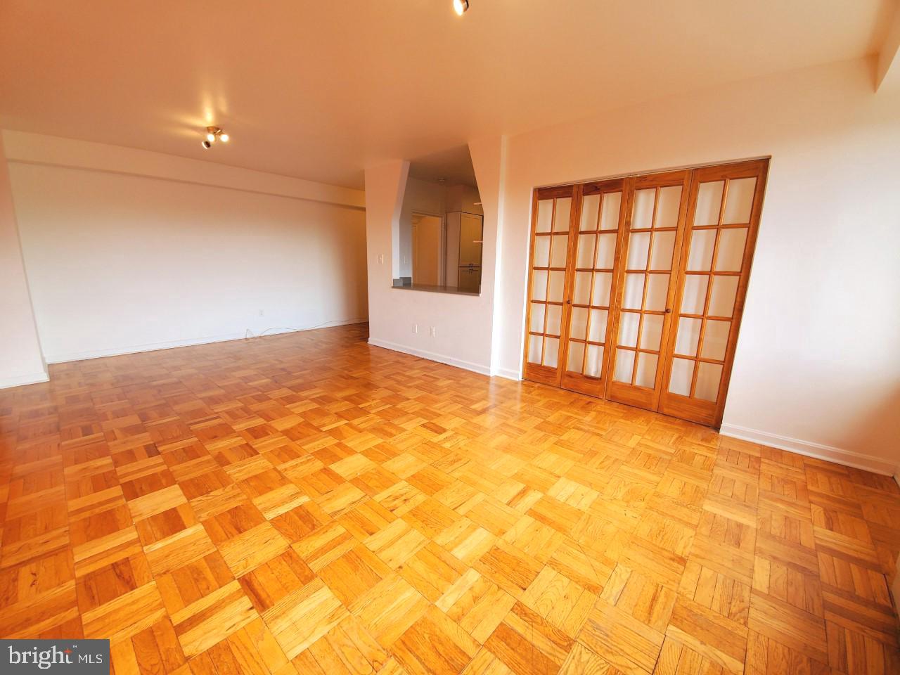 4301 Massachusetts Avenue Northwest, Unit 6007 Washington, DC 20016 - Photo 6 of 24 a view of an empty room with a window