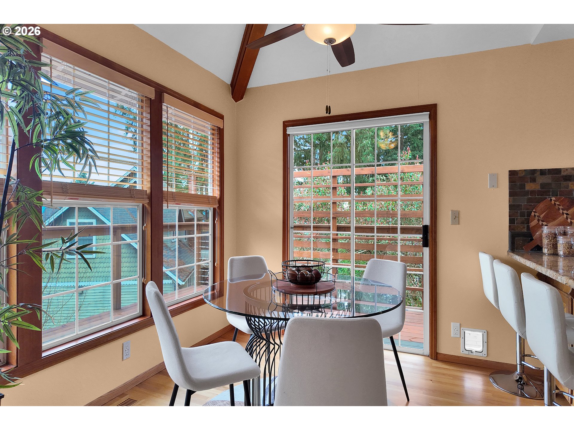 3023 Ashley Loop Eugene, OR 97405 - Photo 11 of 48 a view of a dining room with furniture large windows and wooden floor