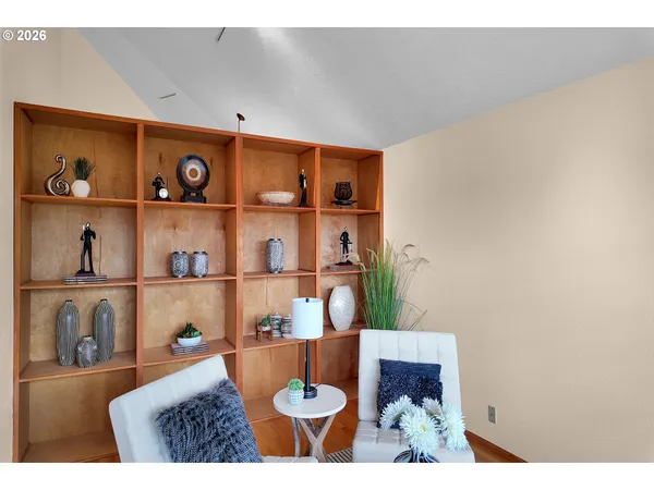 a living room with dining room and furniture