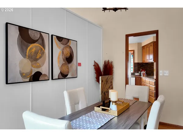 a living room with furniture and painting on the wall