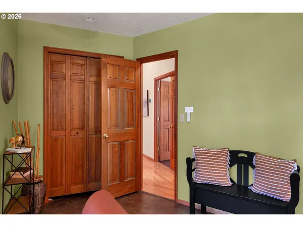 a view of a room with furniture and a window