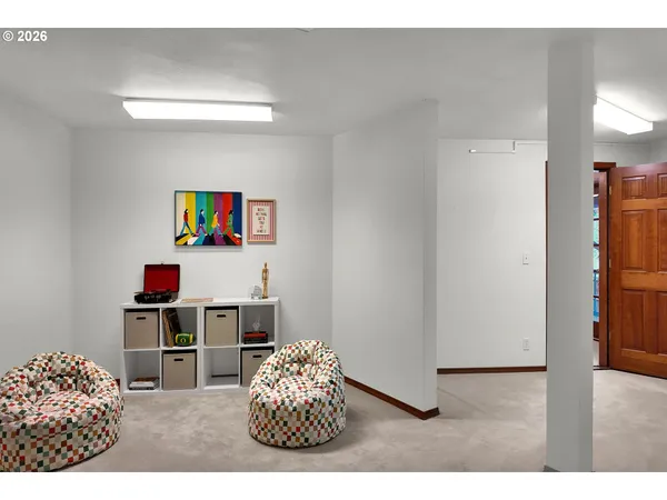 a white room with a table and mirror