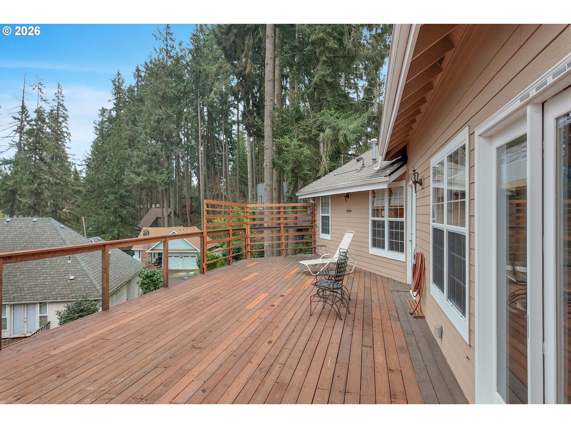3023 Ashley Loop Eugene, OR 97405 - Photo 37 of 48 a balcony with wooden floor and outdoor seating