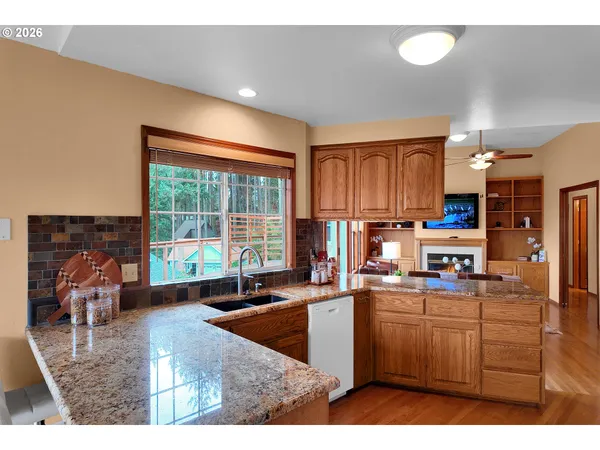 a kitchen that has a sink and a stove in it