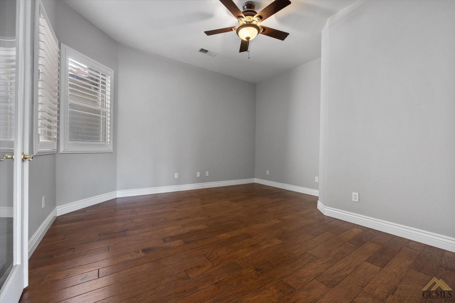 Undisclosed Address Bakersfield, CA 93311 - Photo 17 of 57 a view of a room with wooden floor and windows