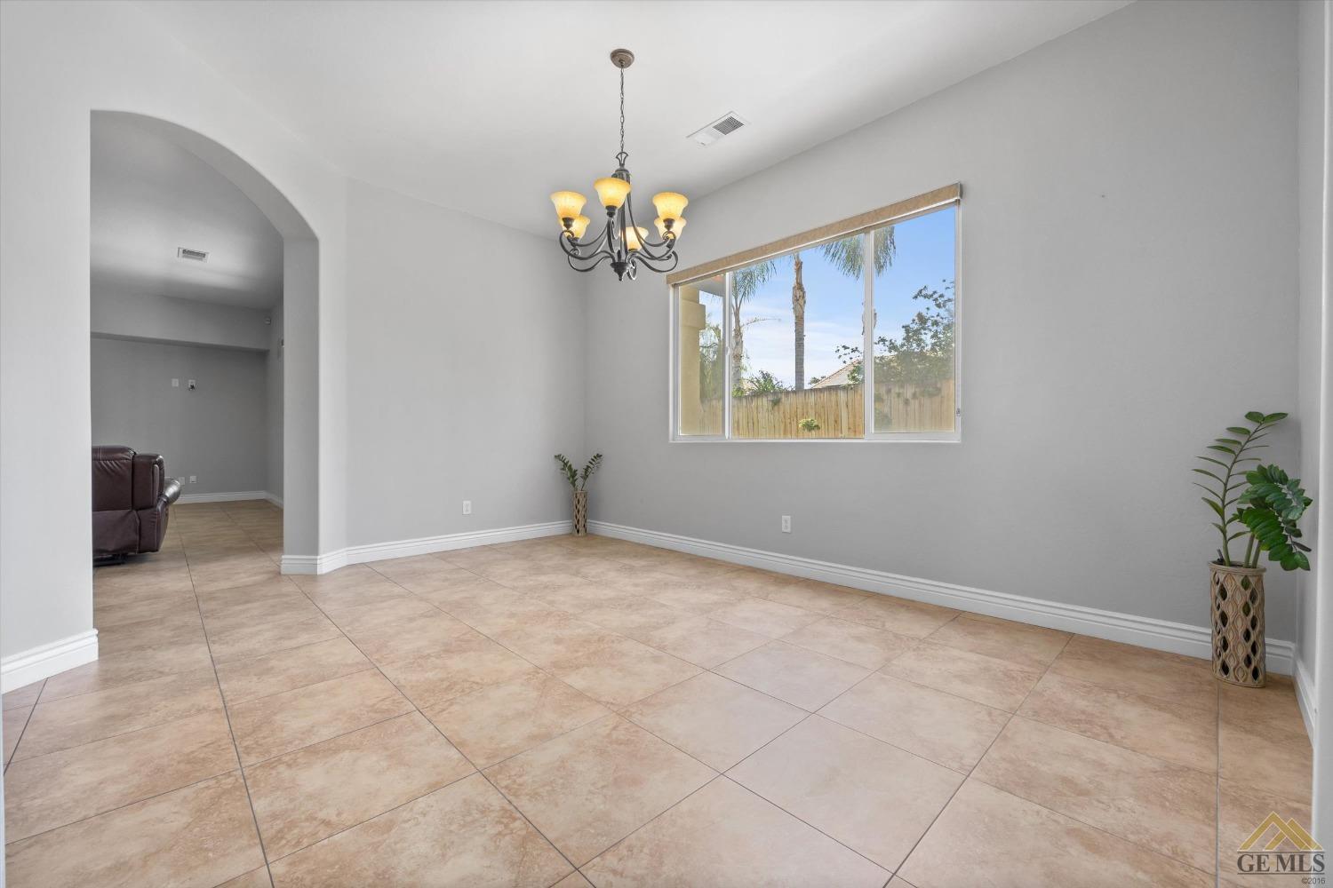 Undisclosed Address Bakersfield, CA 93311 - Photo 18 of 57 a view of an empty room with a window