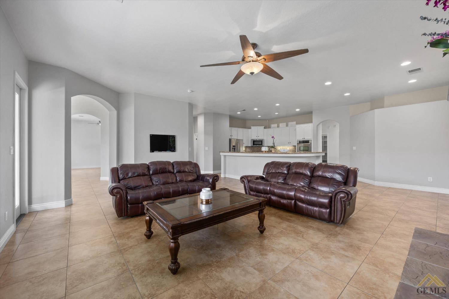 Undisclosed Address Bakersfield, CA 93311 - Photo 23 of 57 a living room with furniture and a flat screen tv