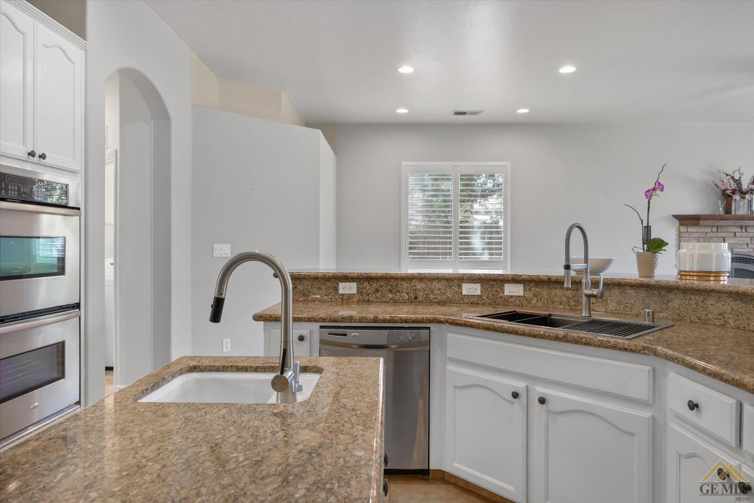 Undisclosed Address Bakersfield, CA 93311 - Photo 31 of 57 a kitchen with a sink and cabinets