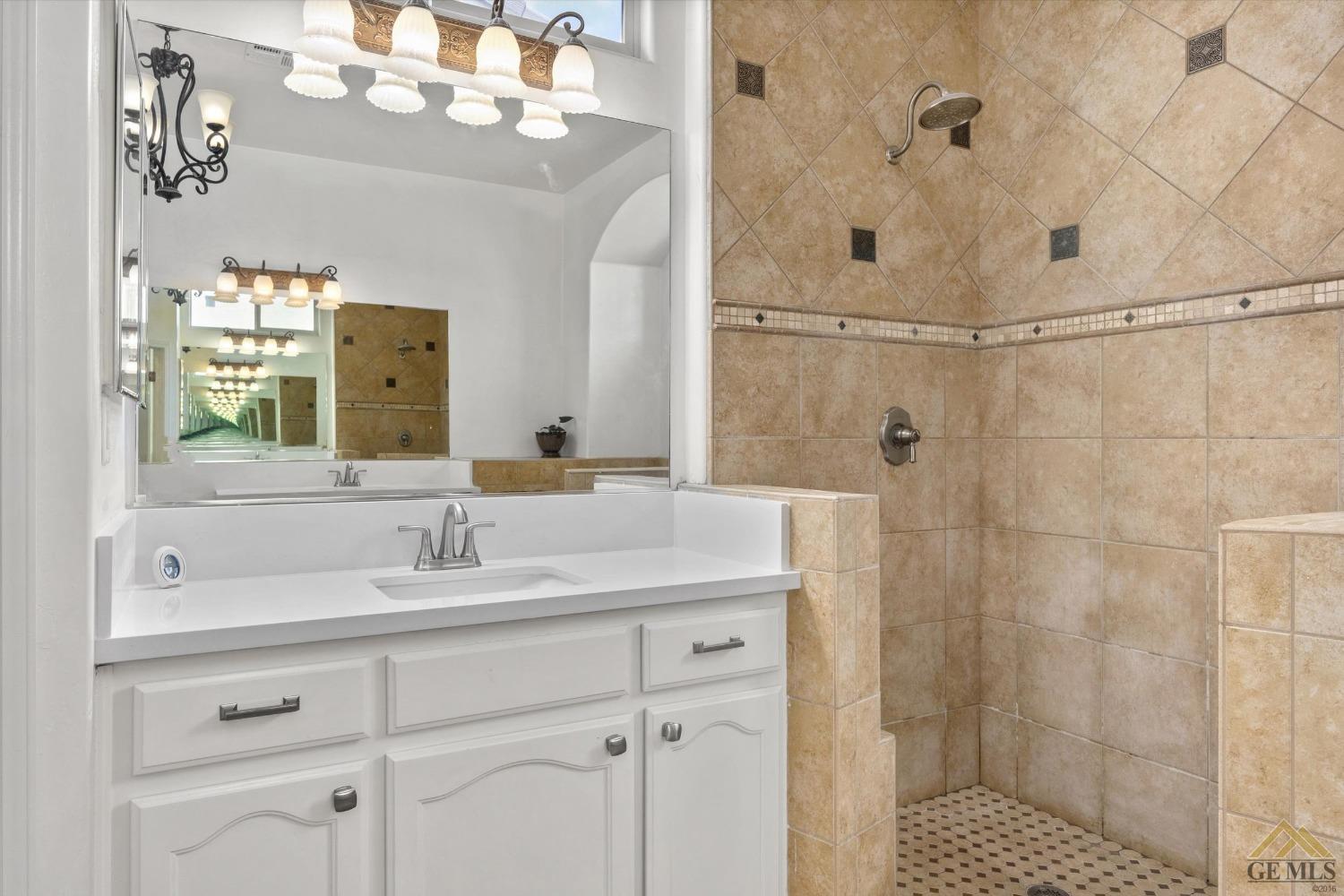 Undisclosed Address Bakersfield, CA 93311 - Photo 39 of 57 a bathroom with a sink vanity granite and shower