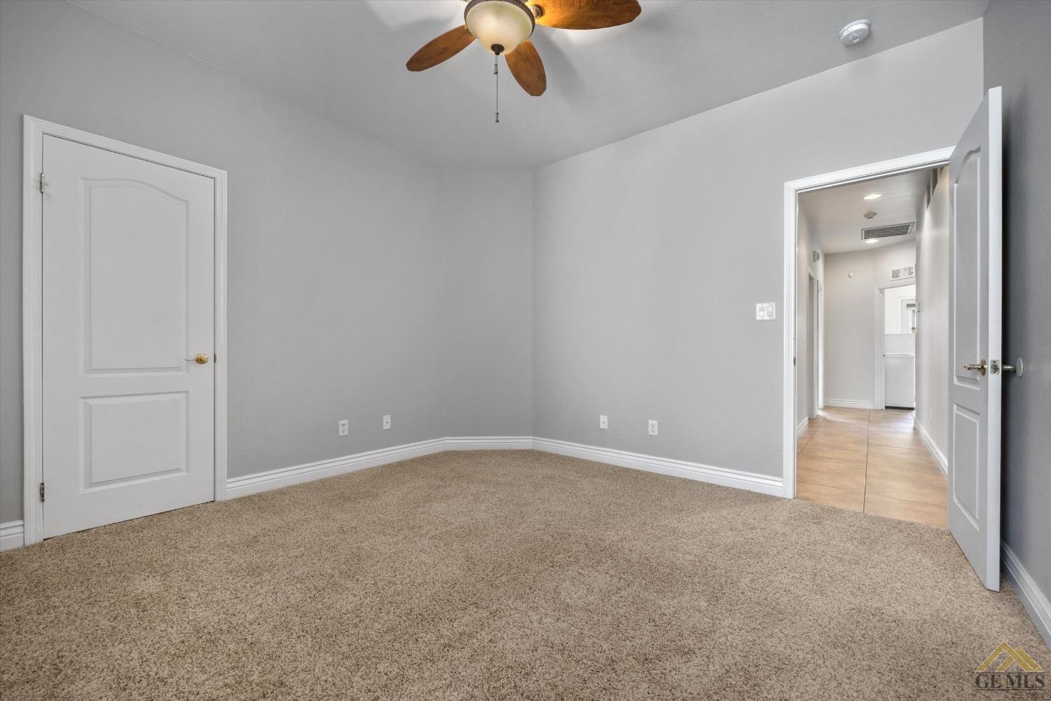 Undisclosed Address Bakersfield, CA 93311 - Photo 44 of 57 a view of an empty room and a ceiling fan
