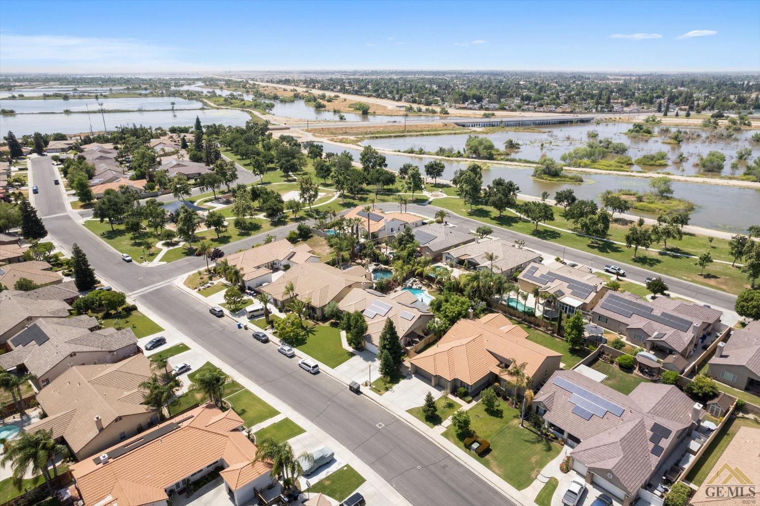 Undisclosed Address Bakersfield, CA 93311 - Photo 10 of 57 an aerial view of a city with lots of residential buildings