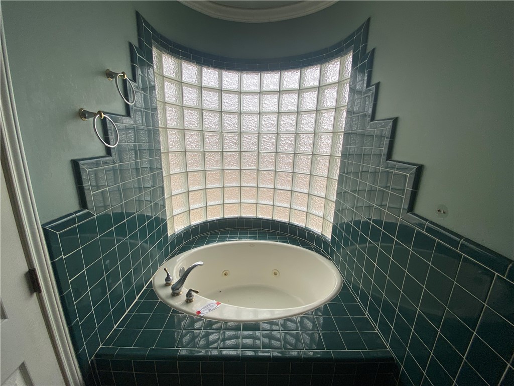 527 County Road 137 Alice, TX 78332 - Photo 11 of 32 a bathroom with a sink and a shower