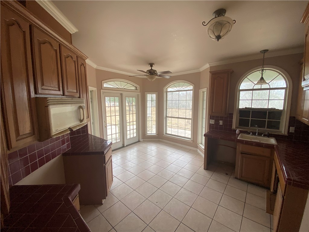 527 County Road 137 Alice, TX 78332 - Photo 5 of 32 a view of a livingroom with furniture window and wooden floor