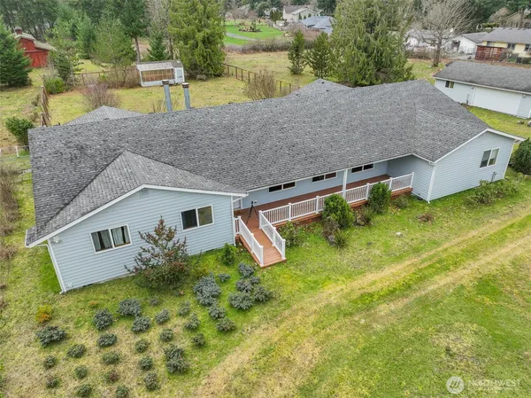 a aerial view of a house with pool yard and sitting area
