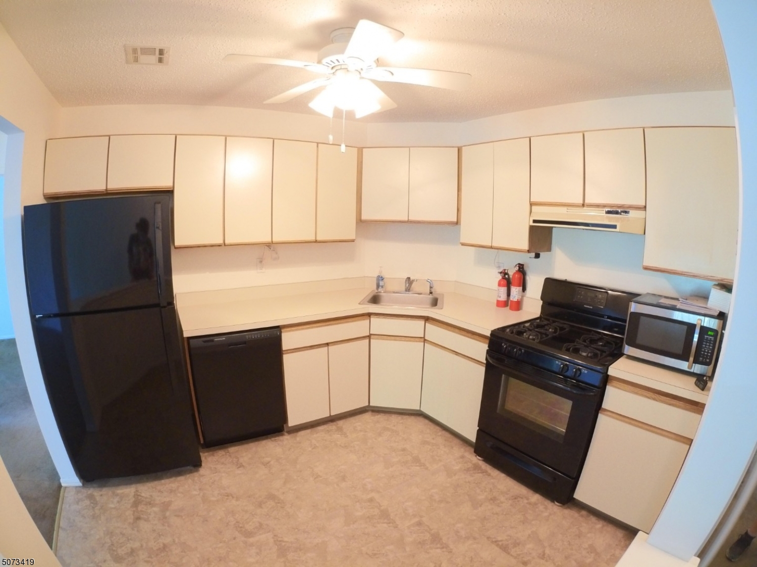 7 Drake Lane Ledgewood, NJ 07852 - Photo 2 of 12 a kitchen with a refrigerator sink stove and cabinets