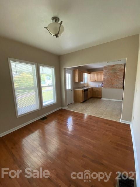 369 North Canton Road Canton, NC 28716 - Photo 13 of 21 a view of empty room with wooden floor and fan