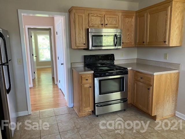 369 North Canton Road Canton, NC 28716 - Photo 15 of 21 a kitchen with a stove and a microwave