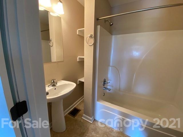 369 North Canton Road Canton, NC 28716 - Photo 18 of 21 a bathroom with a sink and a mirror