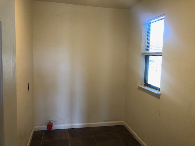 505 Demarett Drive, Unit 12 Point Venture, TX 78645 - Photo 11 of 15 a view of small space with wooden floor and fan