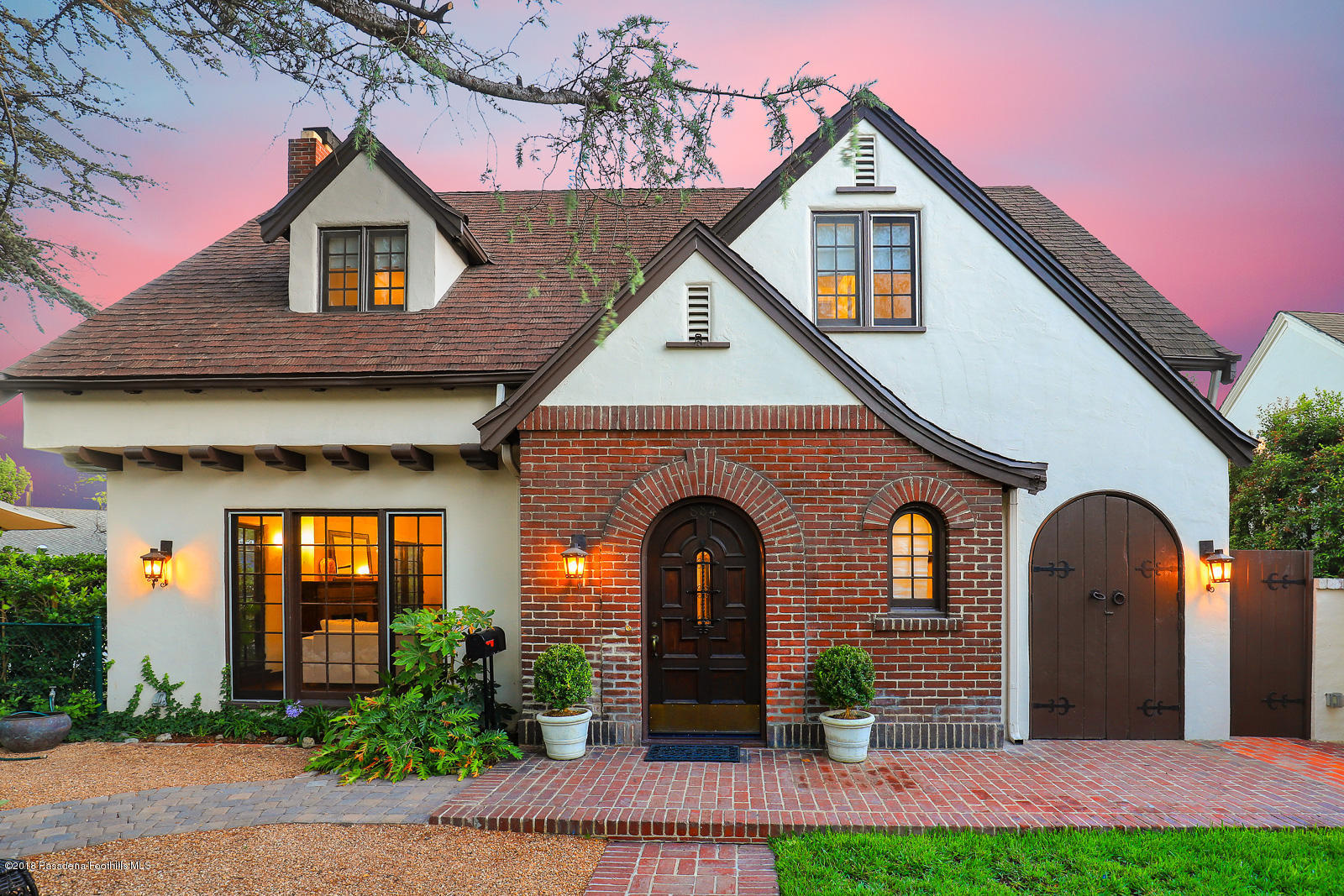 884 Old Mill Road Pasadena, CA 91108 - Photo 2 of 32 a front view of a house with garden