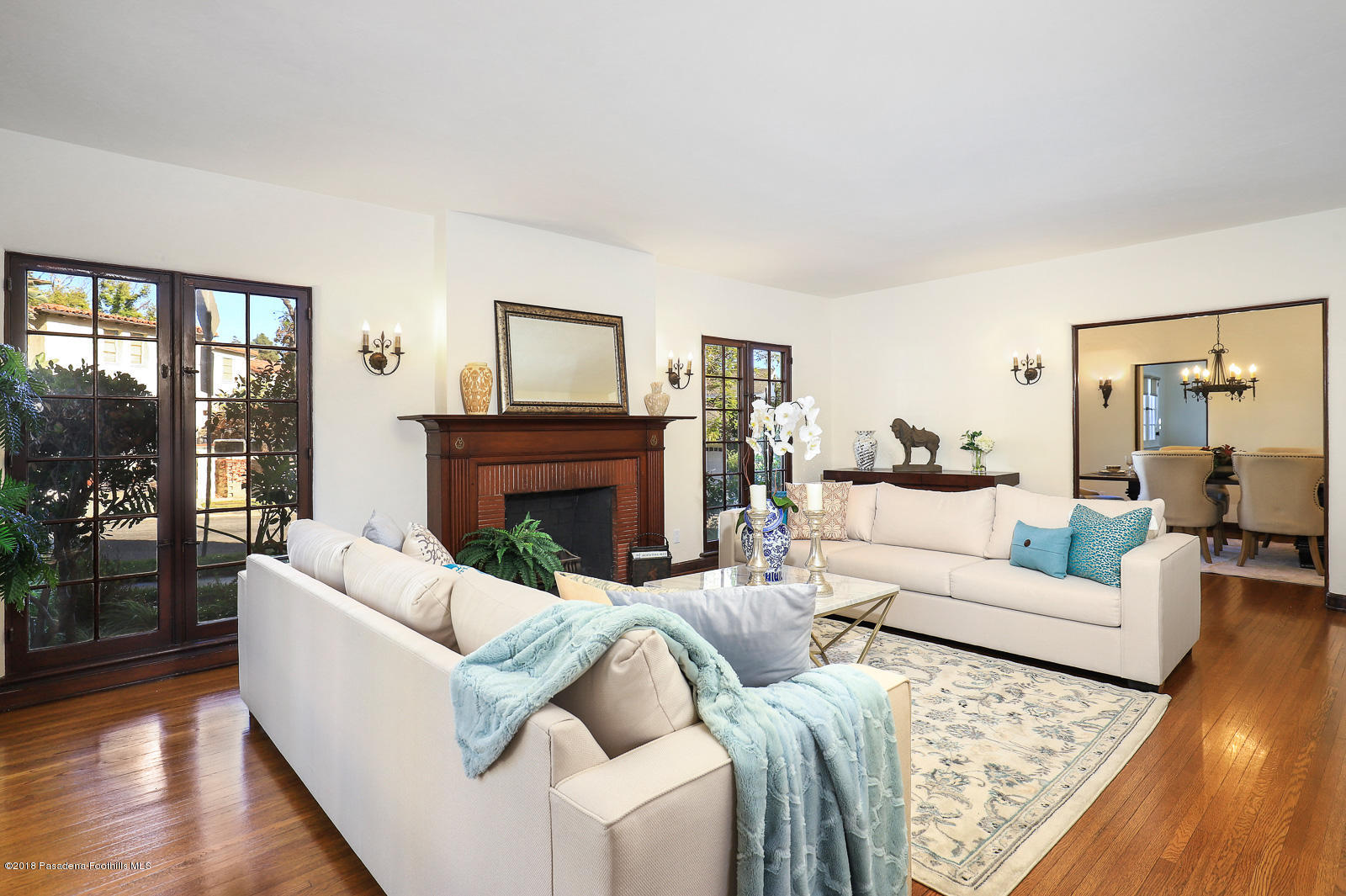 884 Old Mill Road Pasadena, CA 91108 - Photo 13 of 32 a living room with furniture a large window and a fireplace