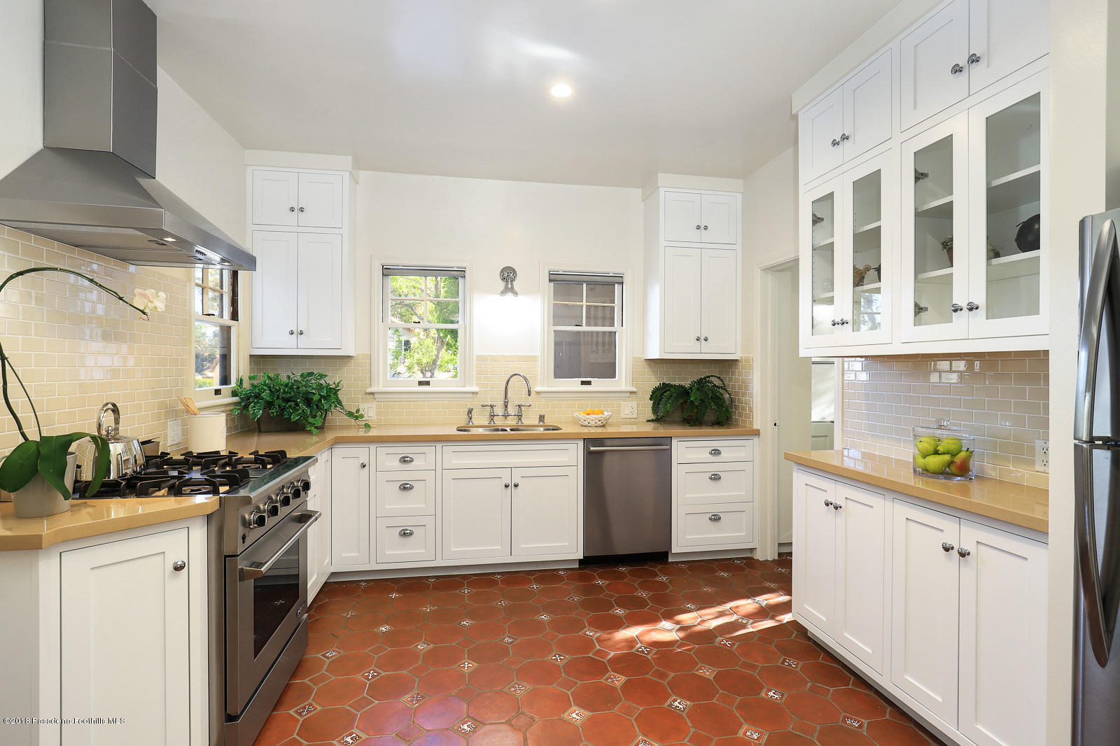 884 Old Mill Road Pasadena, CA 91108 - Photo 18 of 32 a kitchen with a sink stove and cabinets