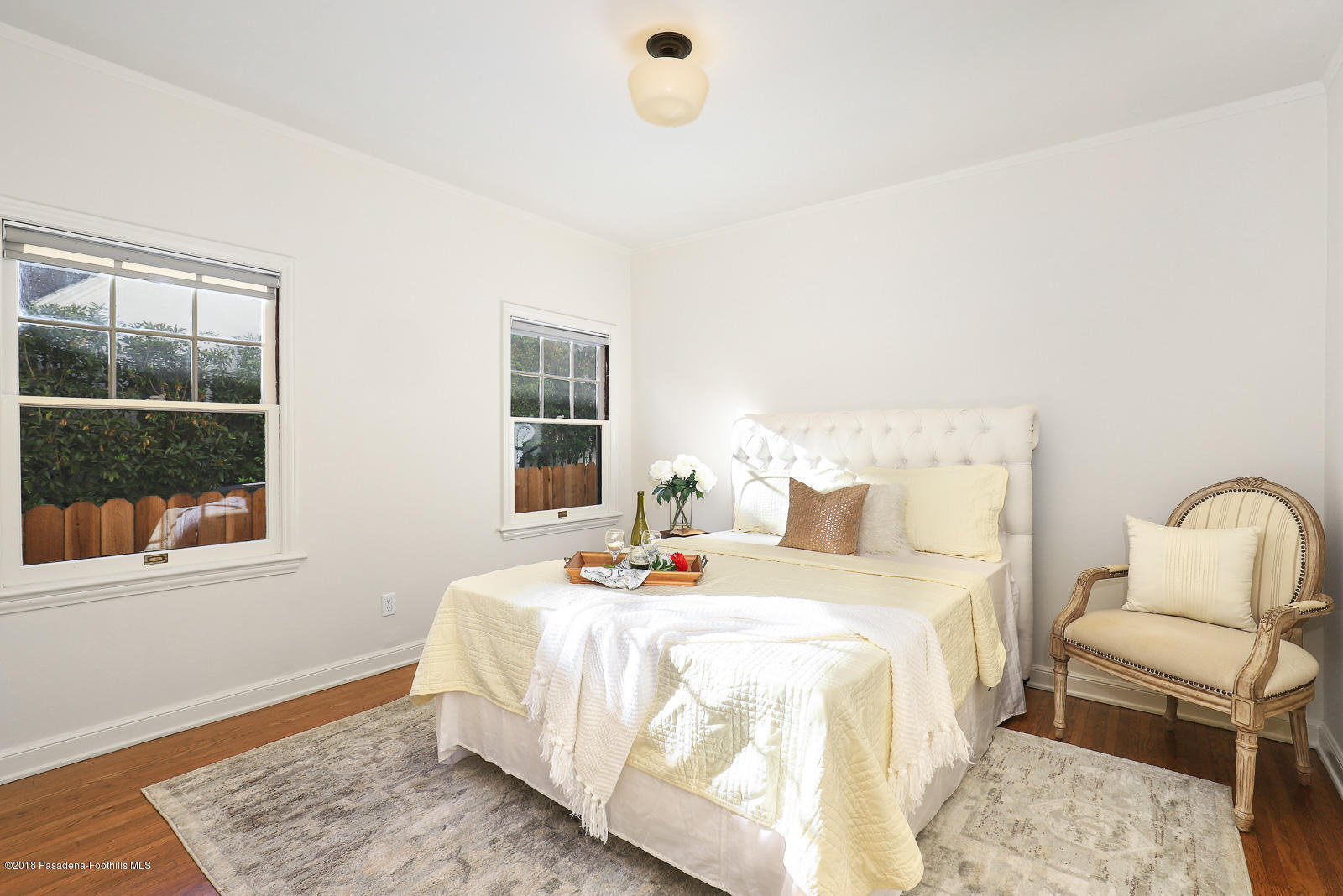 884 Old Mill Road Pasadena, CA 91108 - Photo 23 of 32 a bedroom with a bed a window and potted plant