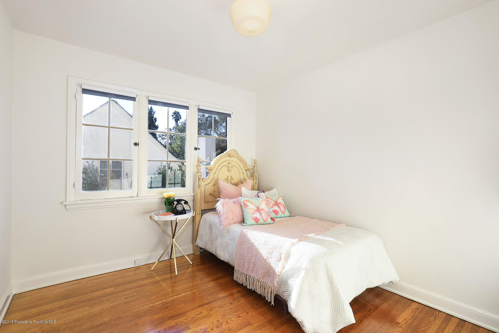 884 Old Mill Road Pasadena, CA 91108 - Photo 27 of 32 a bedroom with a bed and a window