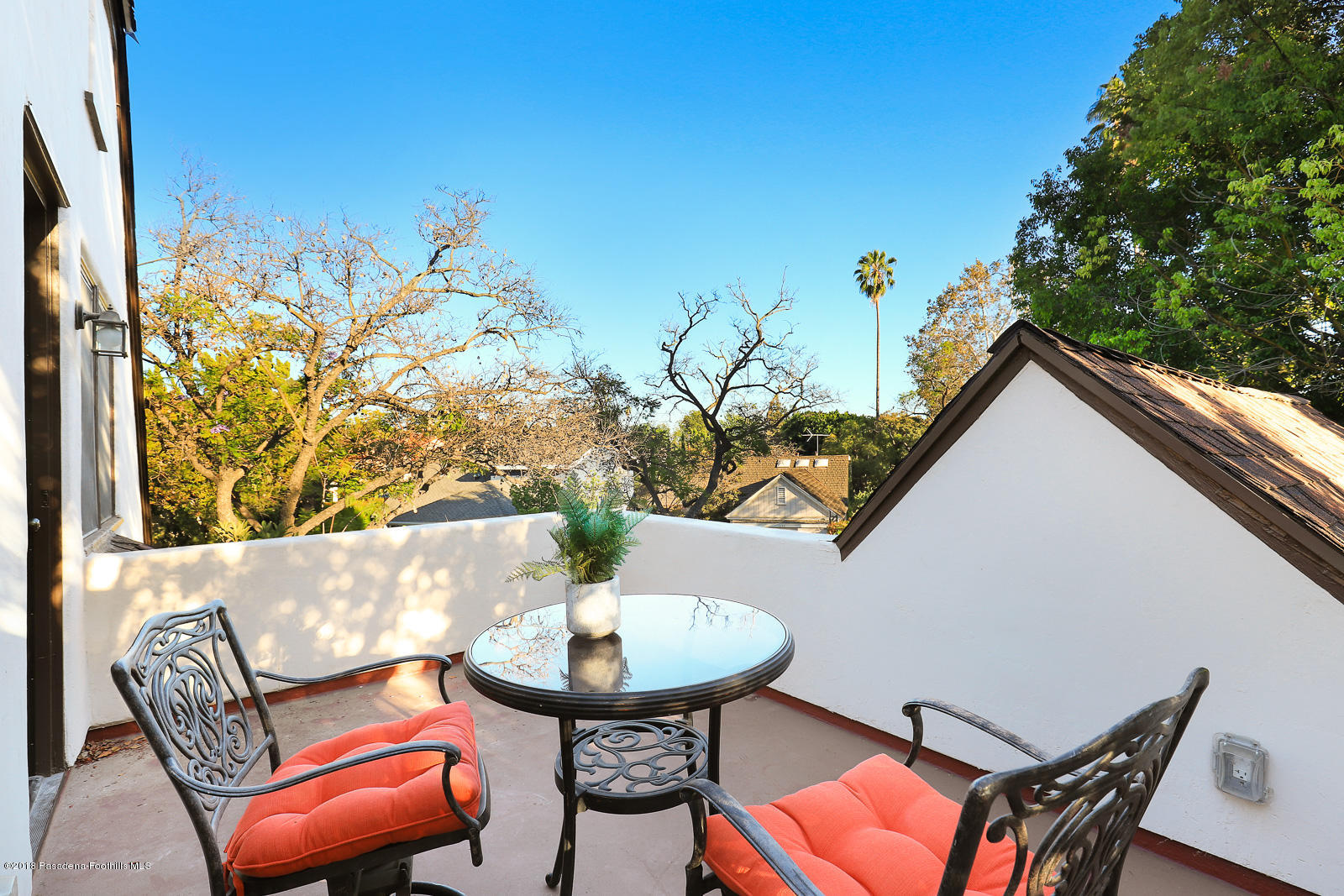 884 Old Mill Road Pasadena, CA 91108 - Photo 29 of 32 a view of a chairs and table in patio