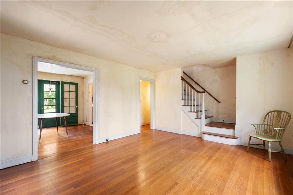 426 Sulgrave Road Pittsburgh, PA 15211 - Photo 26 of 39 a view of an empty room with wooden floor and a window