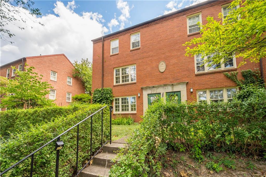 426 Sulgrave Road Pittsburgh, PA 15211 - Photo 3 of 39 a view of a brick building next to a yard