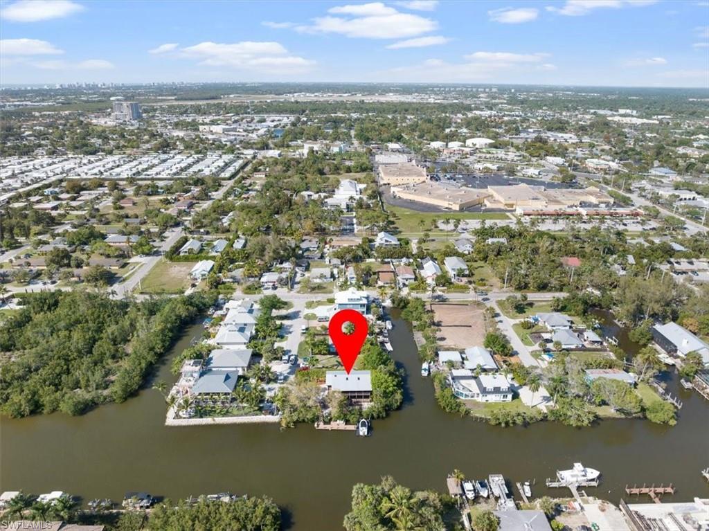 2997 Poplar Street Naples, FL 34112 - Photo 42 of 49 an aerial view of residential building with outdoor space and lake view